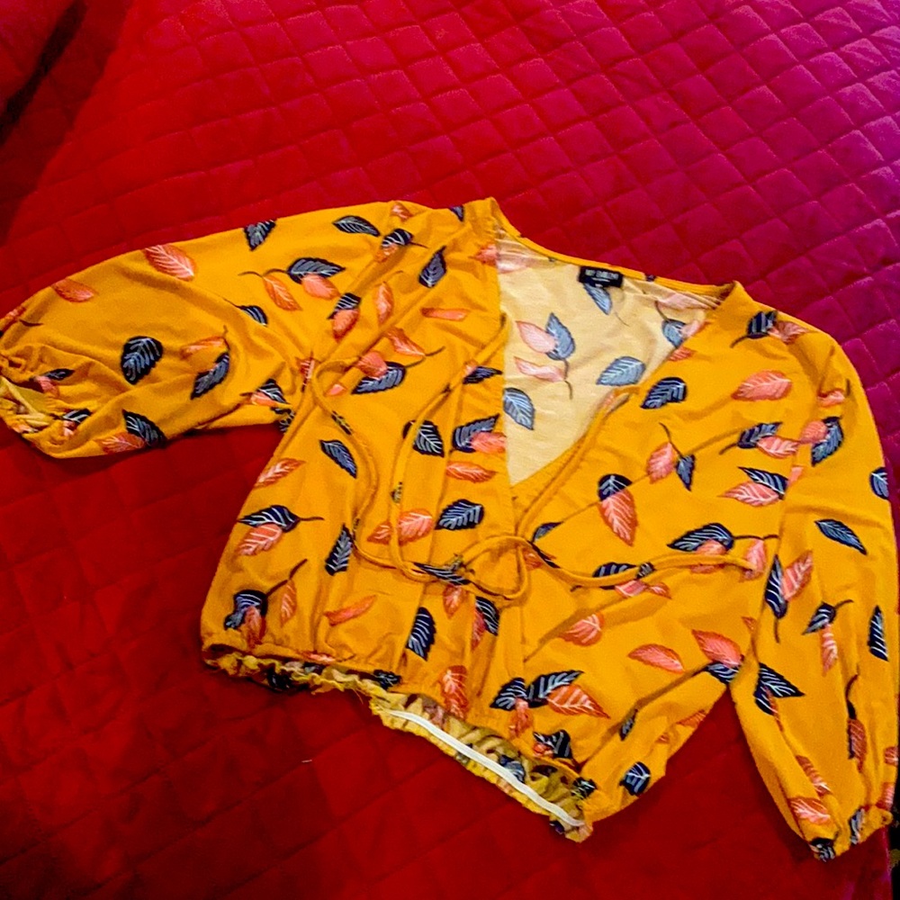 Orange shirt with blue and pink leaves on it. Size XL